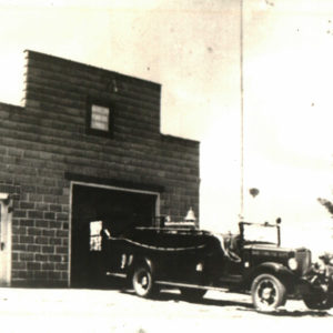 The 1935 1-1/2 ton truck in front of the fire station.