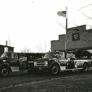The 1971 & 1968 Chevy trucks, pre-renovation to the station.