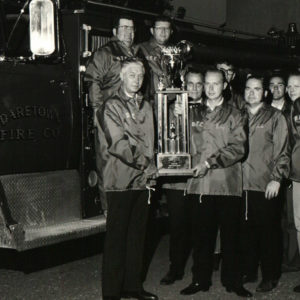 1973 - DFC Members won big at the 50th anniversary Salem County Firemen's Association Parade in Pennsgrove in 1973. Receiving the trophy for the best appearing pumper under 1000 gallons.

Holding the trophy are Chief Joe Layman and Assistant Chief Kenny Wilson, other members pictured include Jack Robinson, Kenny Patrick, Herbert Wentzell, Paul Smith, Leroy Richman, Scott Jess, Joe Newkirk, and Bill Crispin.